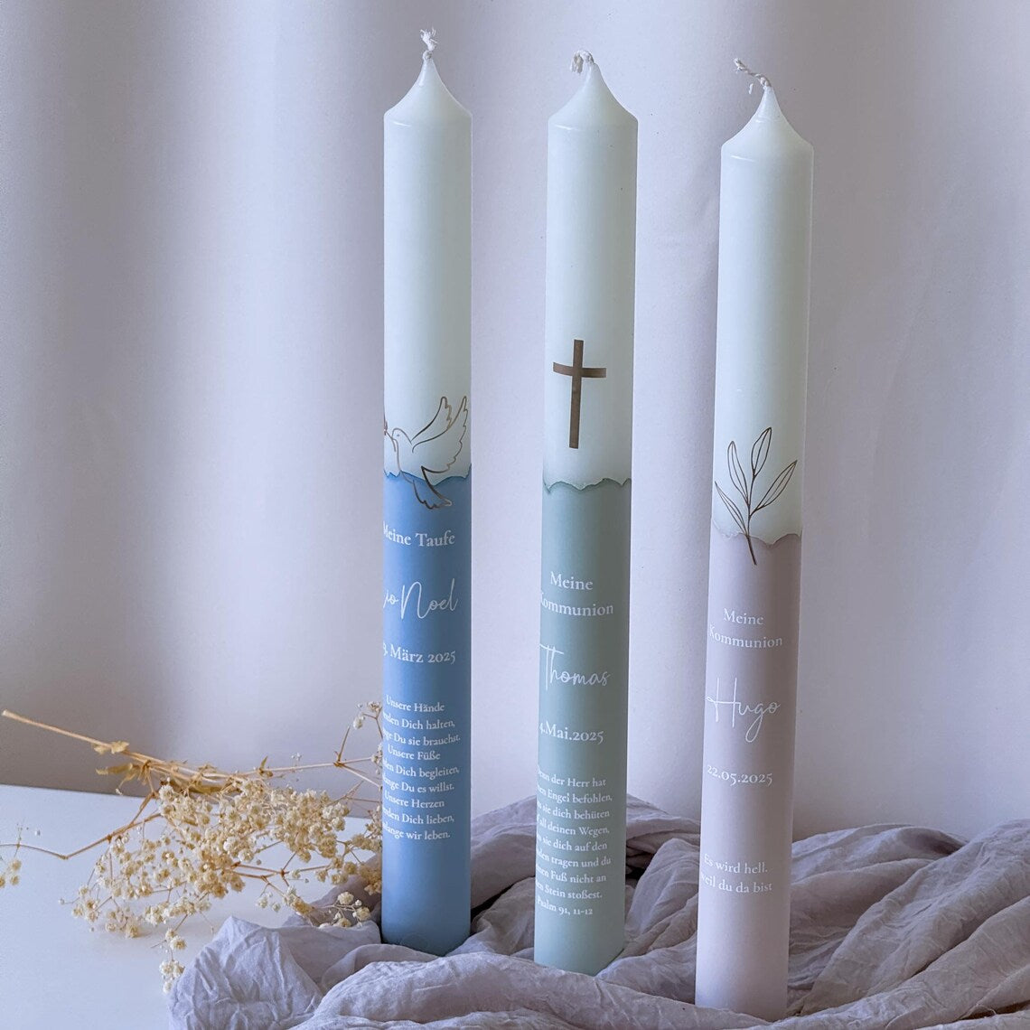 Communion candle or baptism candle with golden symbol and name, date and baptismal saying