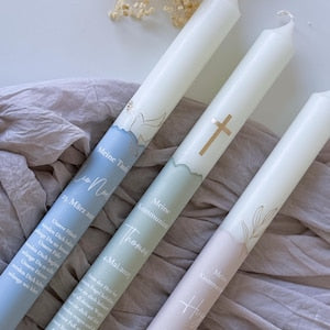 Communion candle or baptism candle with golden symbol and name, date and baptismal saying